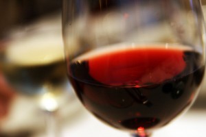 Red wine in glass. Photo by Quinn Dombrowski, Creative Commons license BY-SA 2.0 via Wikimedia Commons.