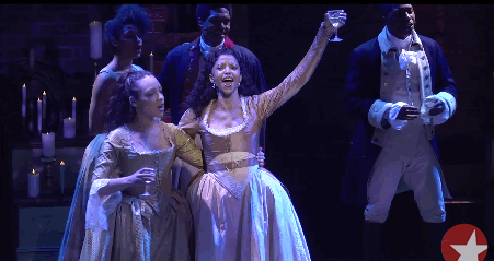 Satisfied: The cast of Hamilton raises glasses in a toast. Madeira, perhaps?