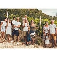 The Škegro family gathers with pride to show off their Bosnia-Herzegovina vineyards. (Photo from importer Vinum USA Inc.)
