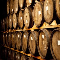 Rows of full barrels signal good news for consumers; for wineries, not so much.